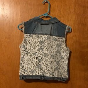 Cutie pie denim vest with lace back.